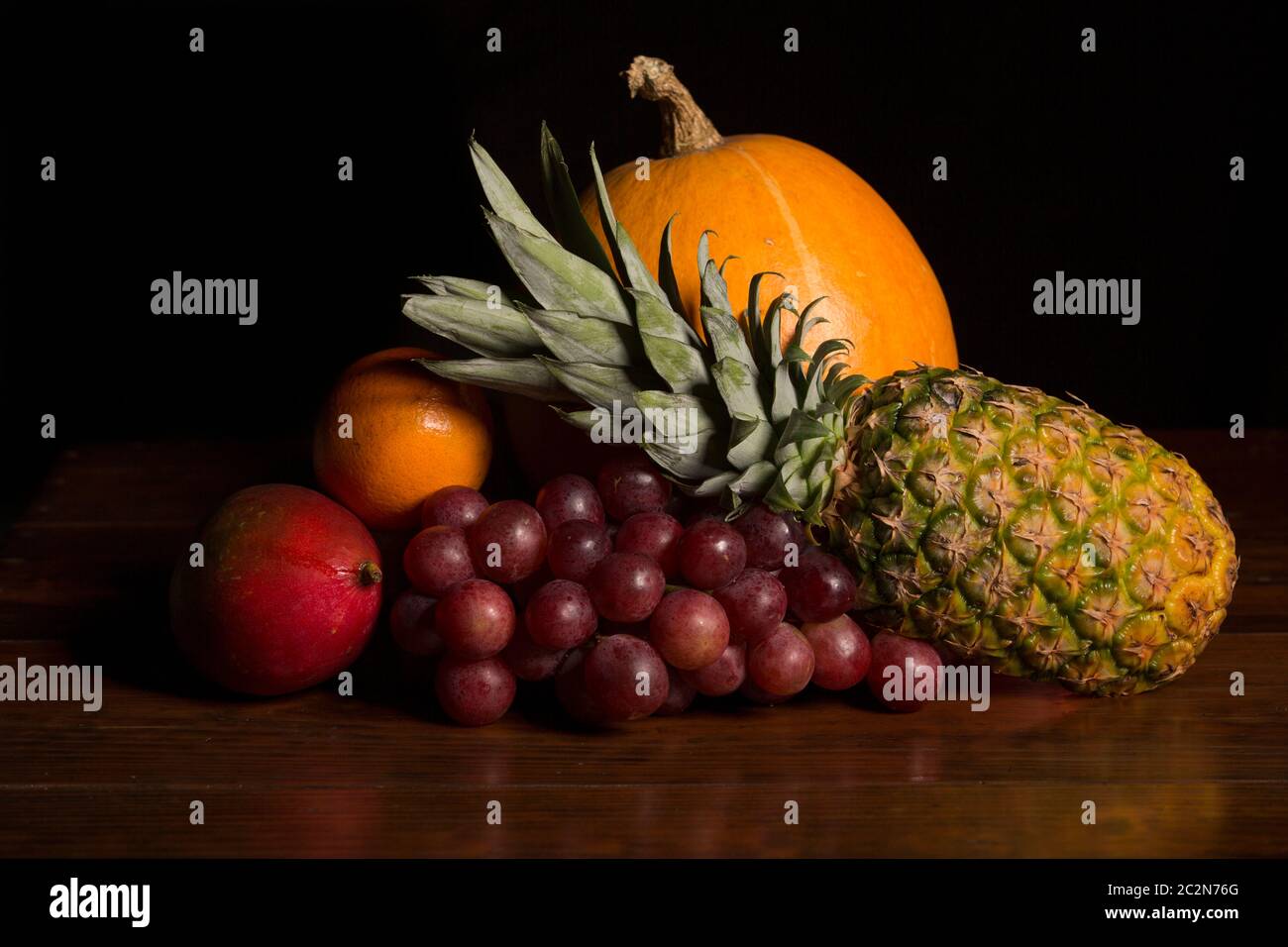 variety of fruits on a wooden table, studio picture Stock Photo - Alamy
