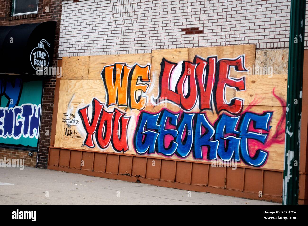Colorful graphic 'We Love You George' on Time Bomb antique store plywood protectors honoring the life of George Floyd. Minneapolis Minnesota MN USA Stock Photo