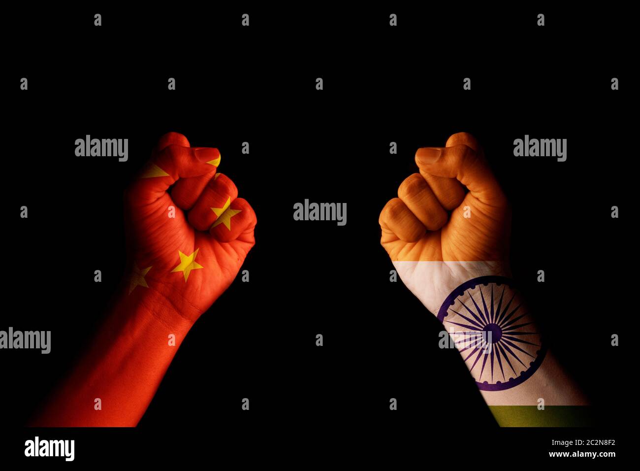 Concept of Dispute or conflict between India and China showing with fist hands. Stock Photo