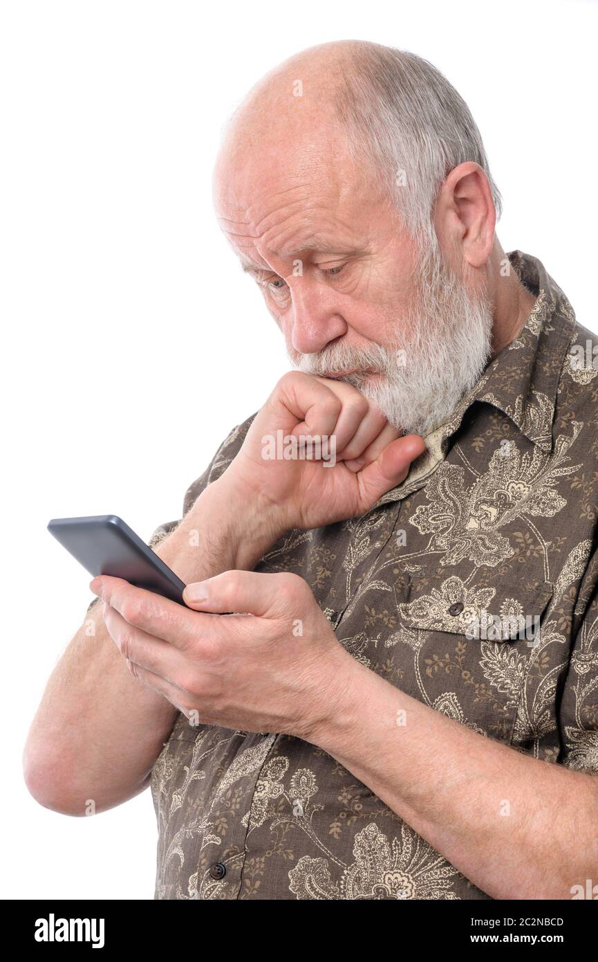 senior man surprized and confused with something at mobile smartphone, isolated on white Stock Photo