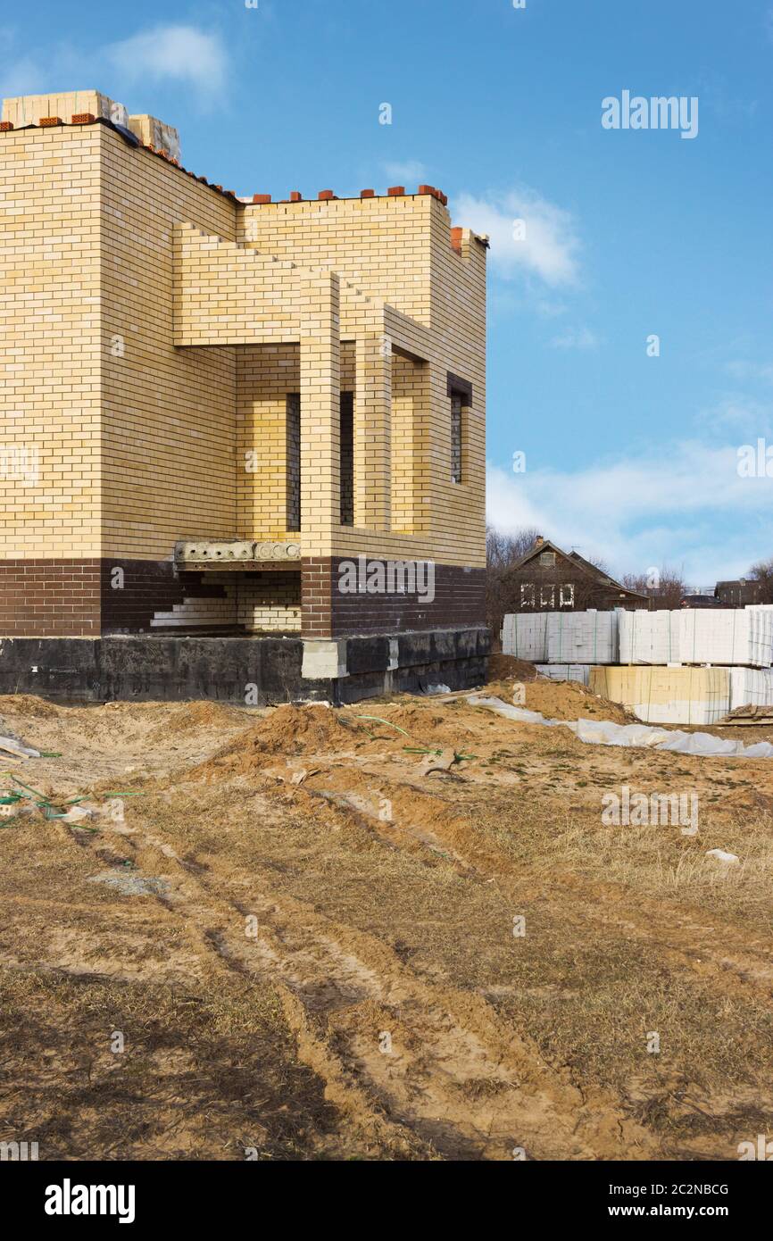 New house of yellow brick Stock Photo - Alamy