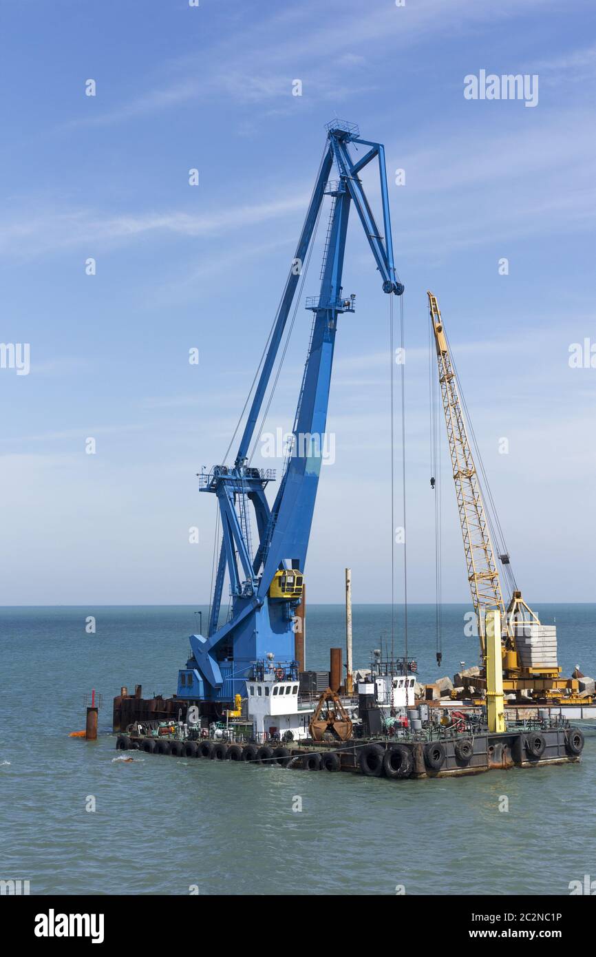 crane barge doing marine heavy lift installation works in the gulf or the sea Stock Photo