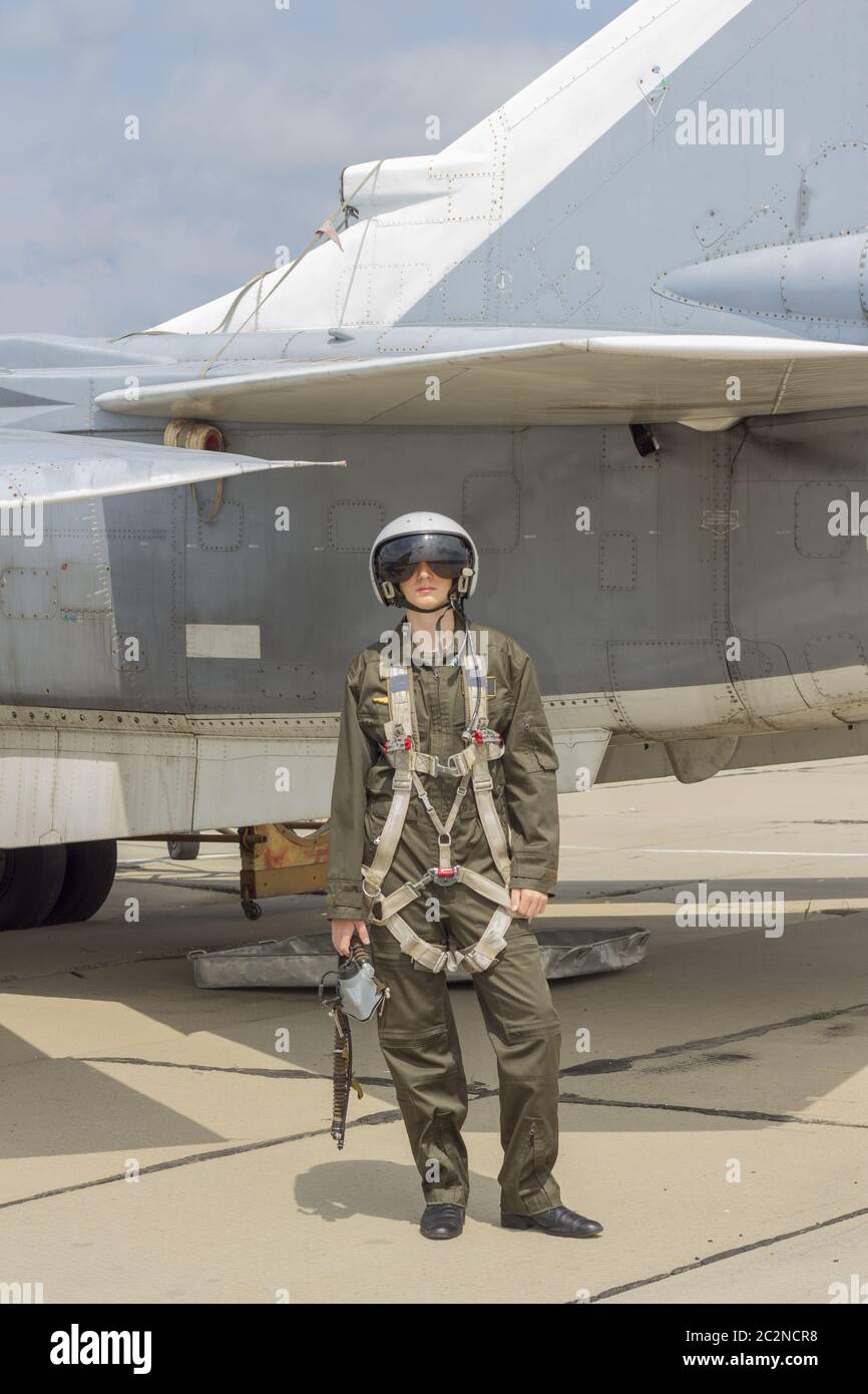 Military pilot in helmet stands near jet plane Stock Photo Alamy