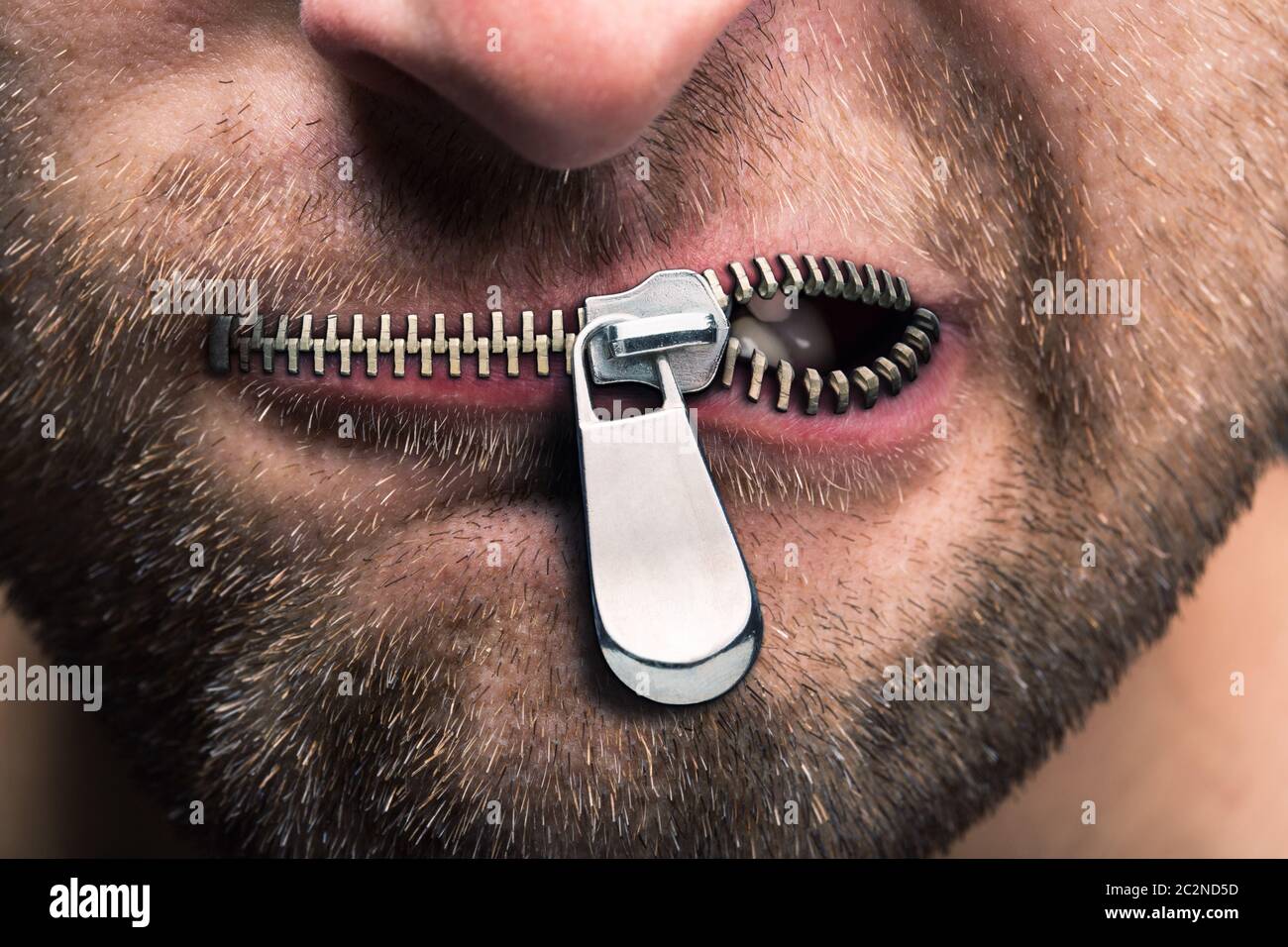 Insubordinate man with zipped mouth Stock Photo Alamy