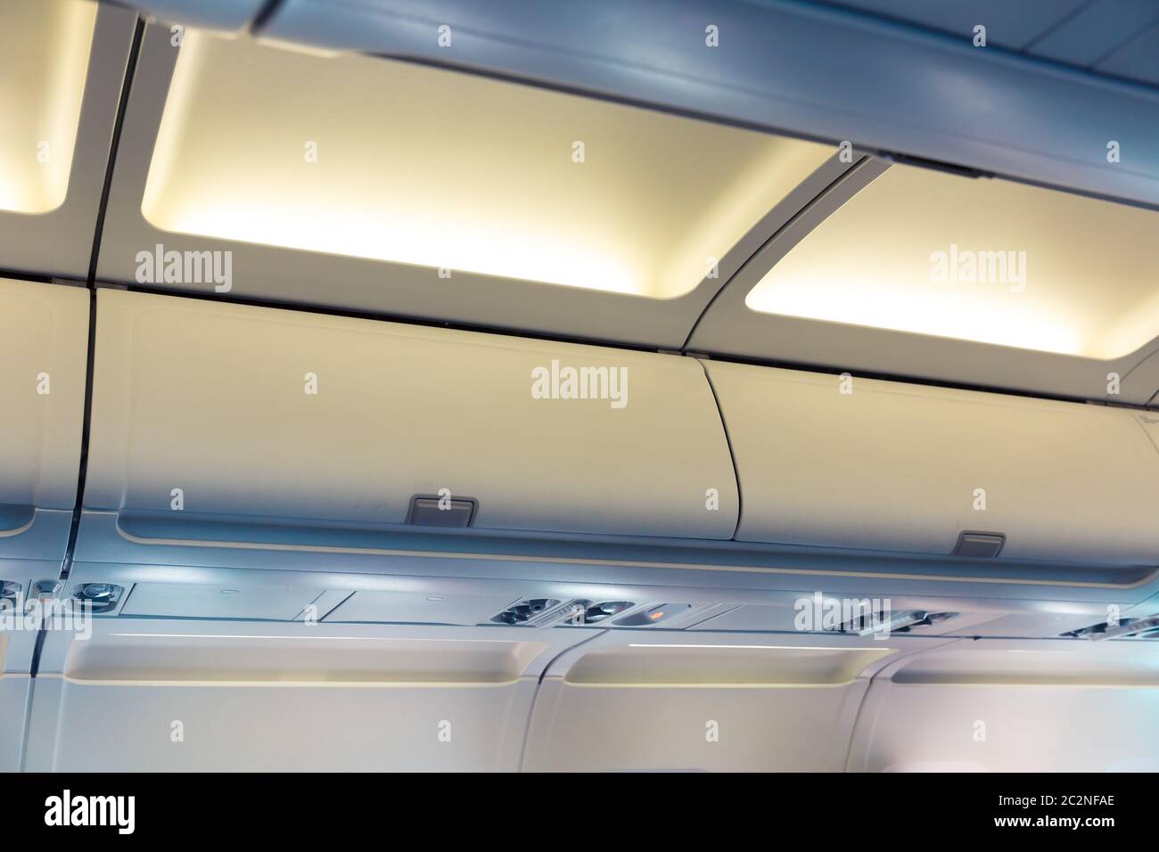 Hand luggage compartments in the plane Stock Photo Alamy
