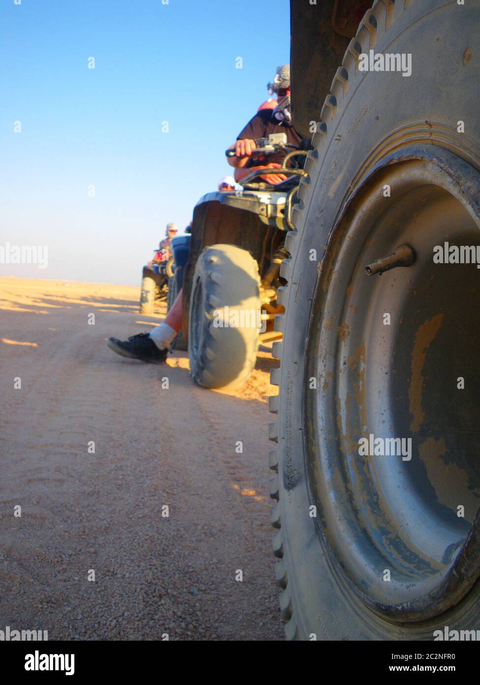 Four wheel motorbike rally in desert Stock Photo - Alamy