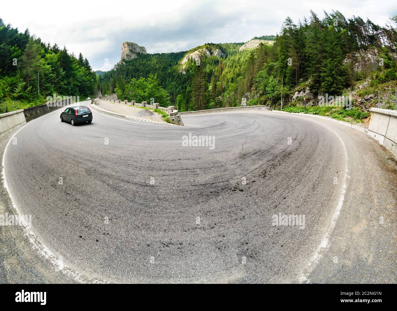 Mountain road at its turn Stock Photo