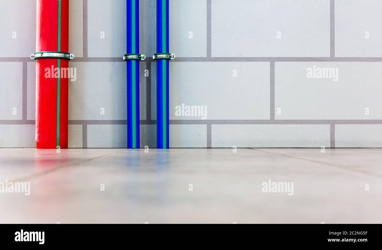 Red and blue water pipes Stock Photo Alamy