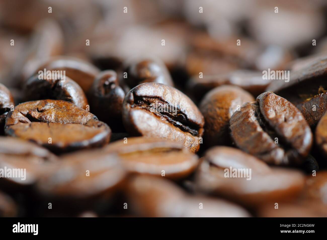roasted coffee beans macro background Stock Photo - Alamy
