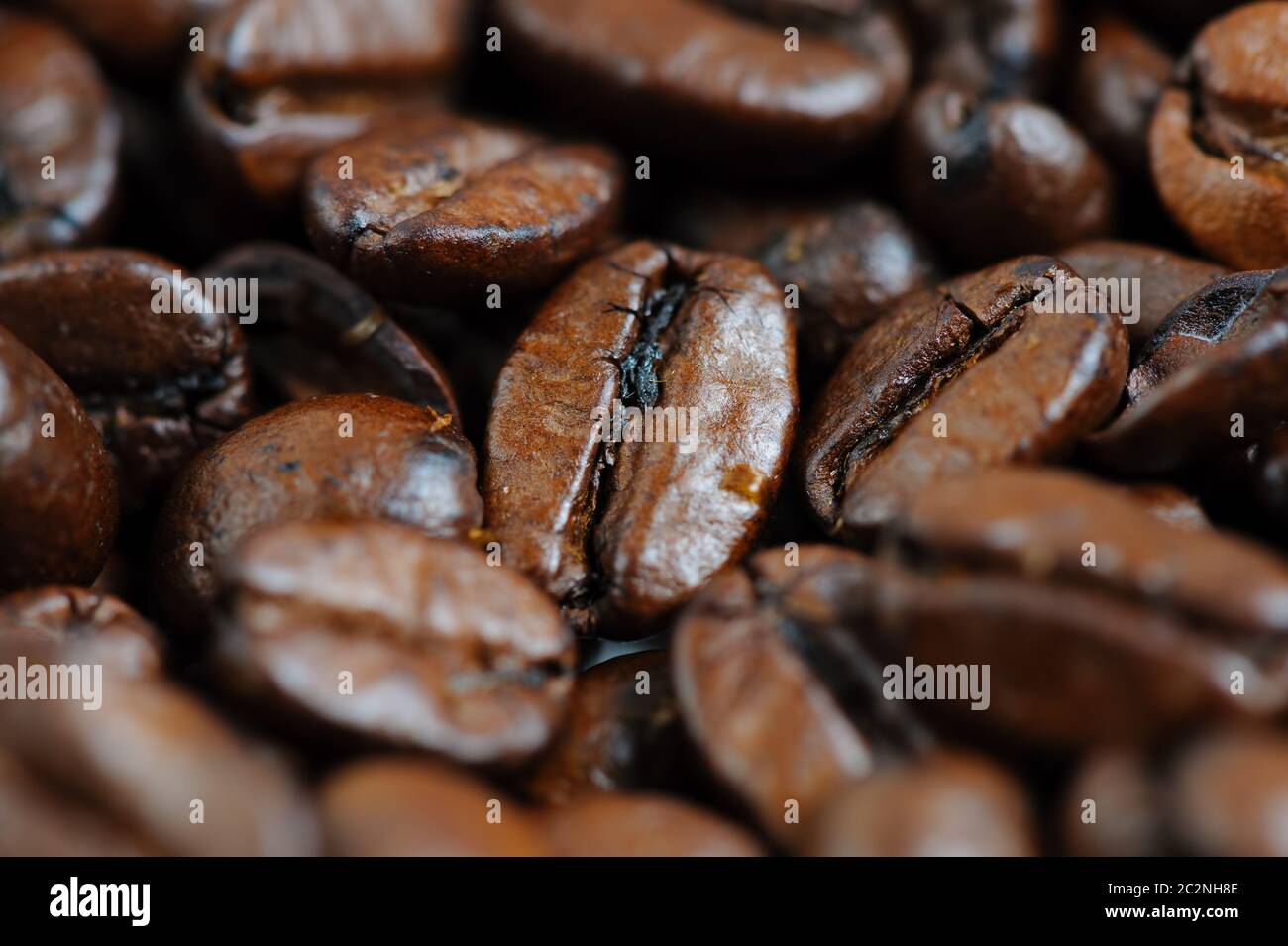 roasted coffee beans macro background Stock Photo - Alamy