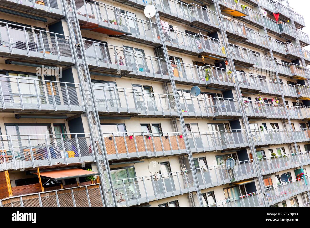 Typical block apartment building with many balconies, Europe. Big house