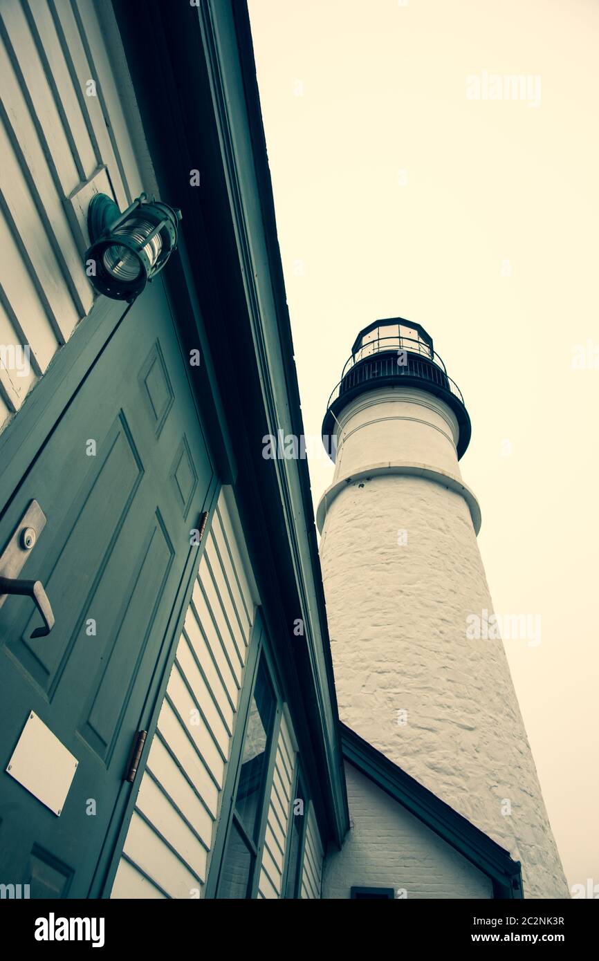 Portland Head Lighthouse towering skyward crossed processed image in Maine New England USA. Stock Photo