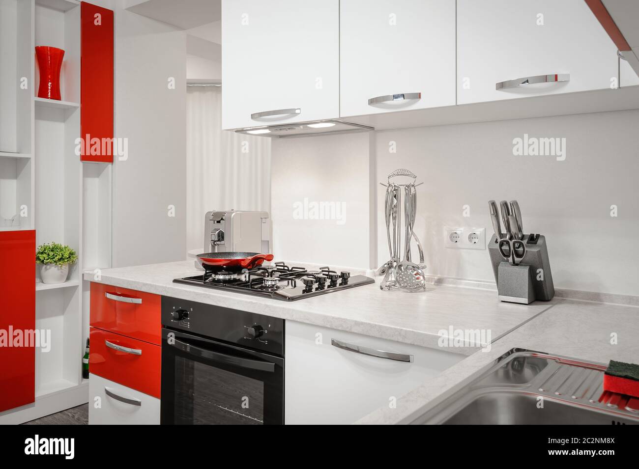 Modern red and white kitchen interior Stock Photo Alamy