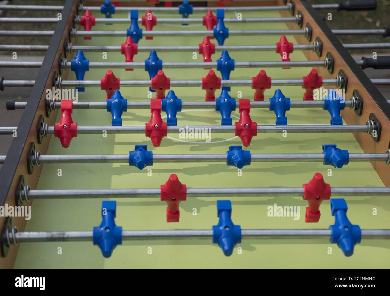 Table football in the entertainment center. Closeup image of plastic