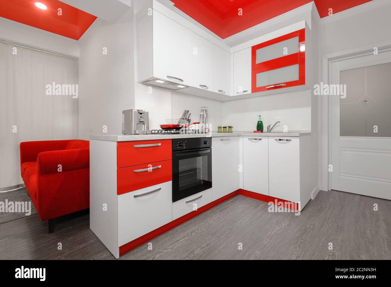 Modern red and white kitchen interior Stock Photo Alamy