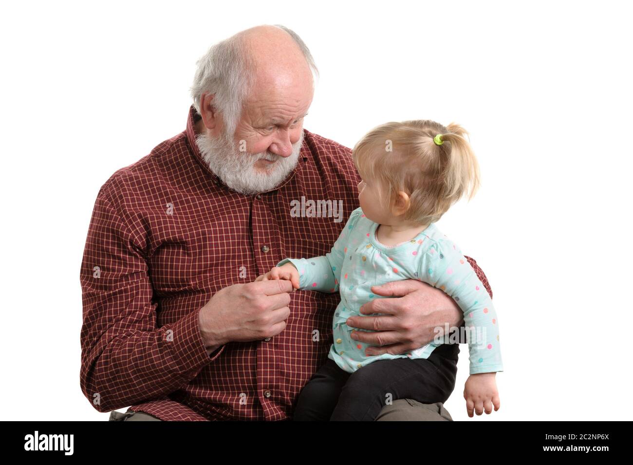 Old good grandpa and his little granddaughter Stock Photo