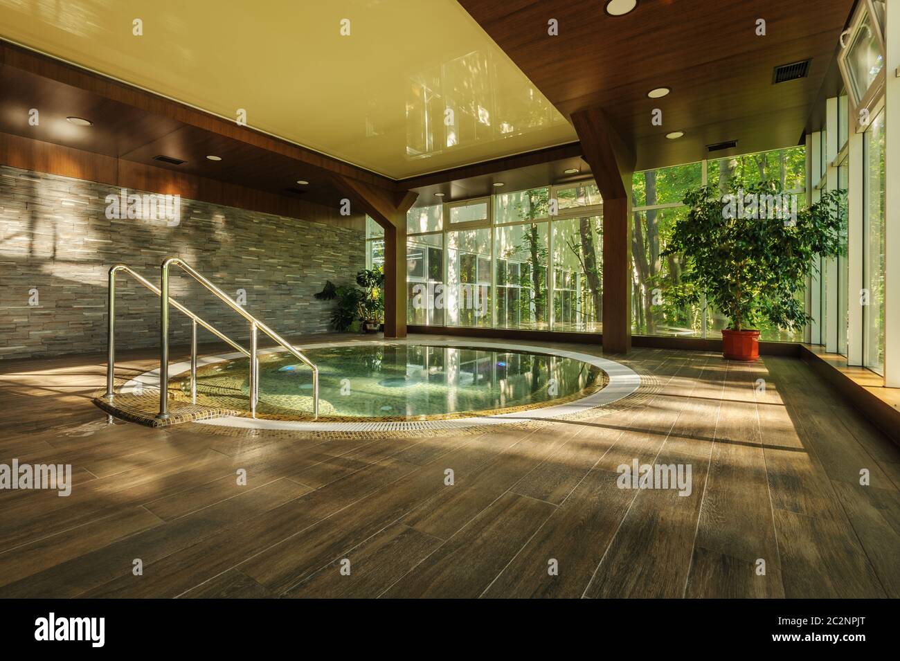 Big round jacuzzi bath in spa center, early morning Stock Photo Alamy