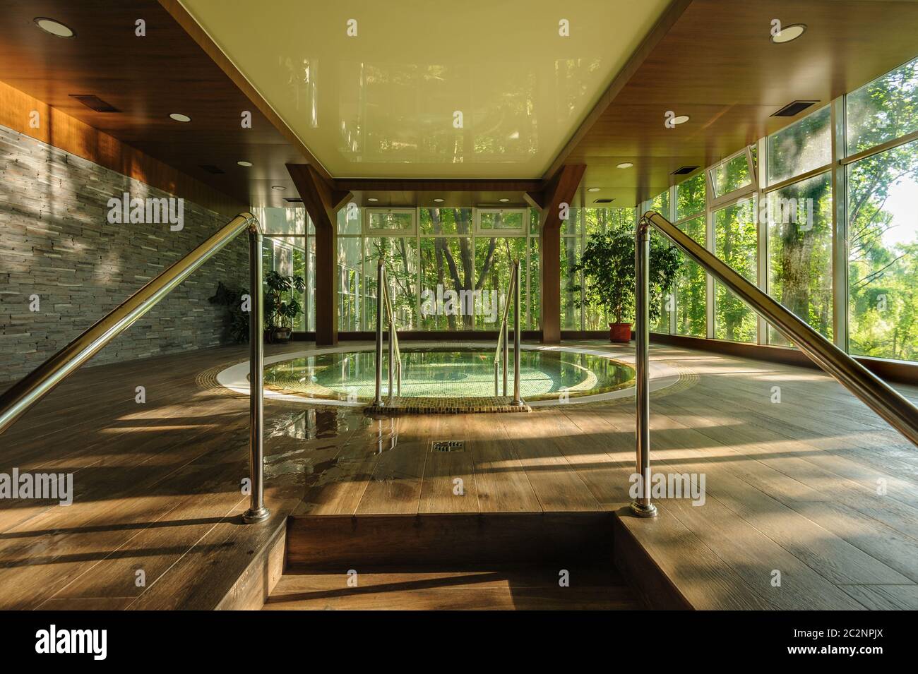 Big round jacuzzi bath in spa center, early morning Stock Photo Alamy
