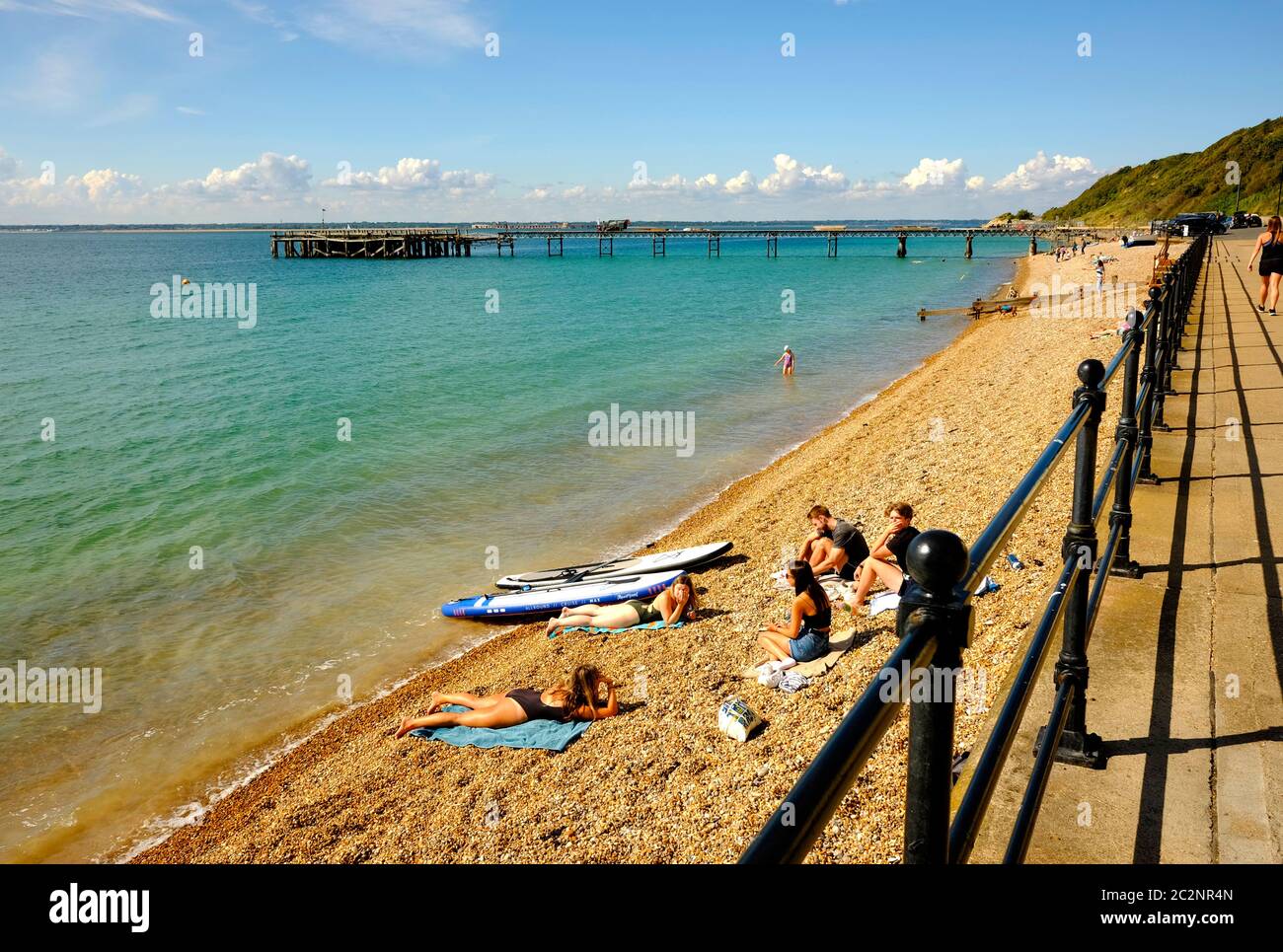 Beachgoers sunbathing Totland Bay Isle of Wight Stock Photo