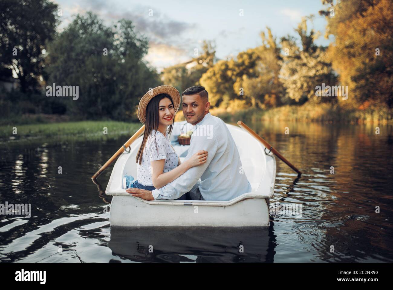 Happy love couple boating on lake at summer day. Romantic date, boat ...