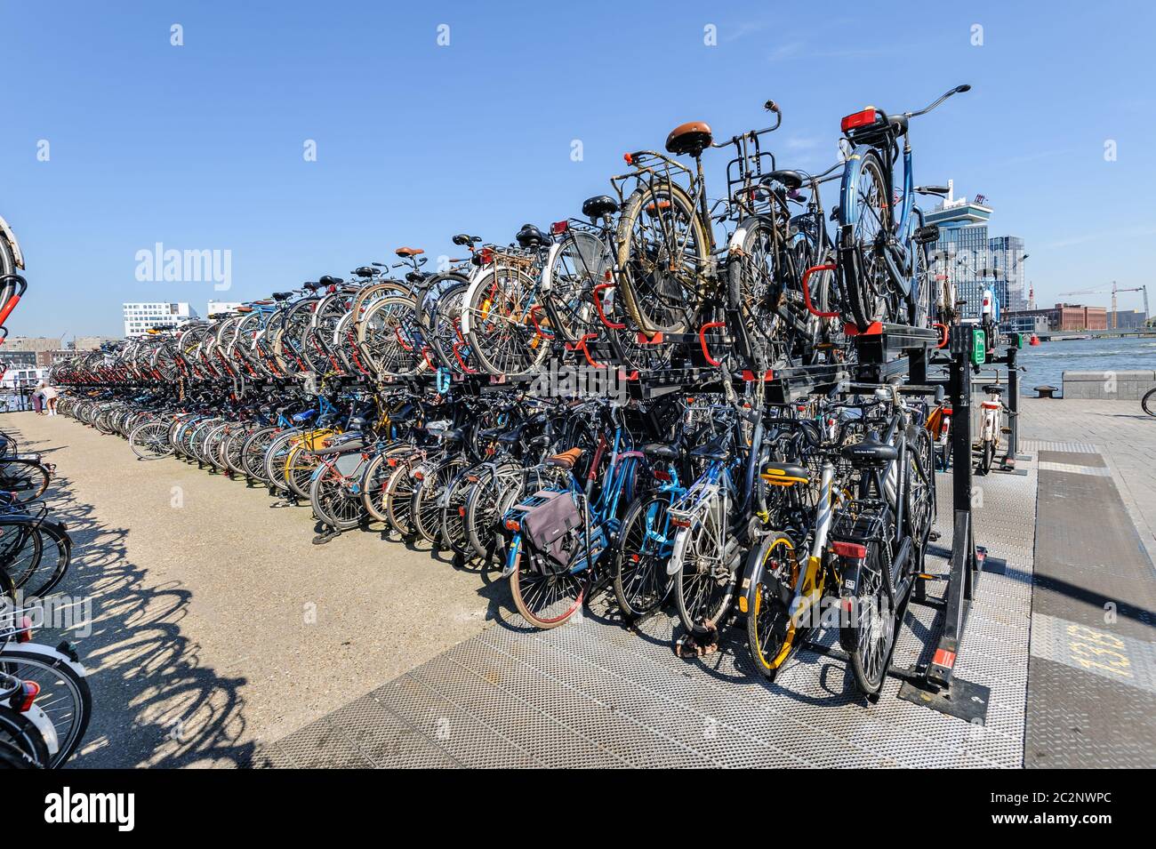AMSTERDAM, HOLLAND - AUGUST 01: Amsterdam Central station. Many bicycles parked in front of the Central station on August 01, 20 Stock Photo