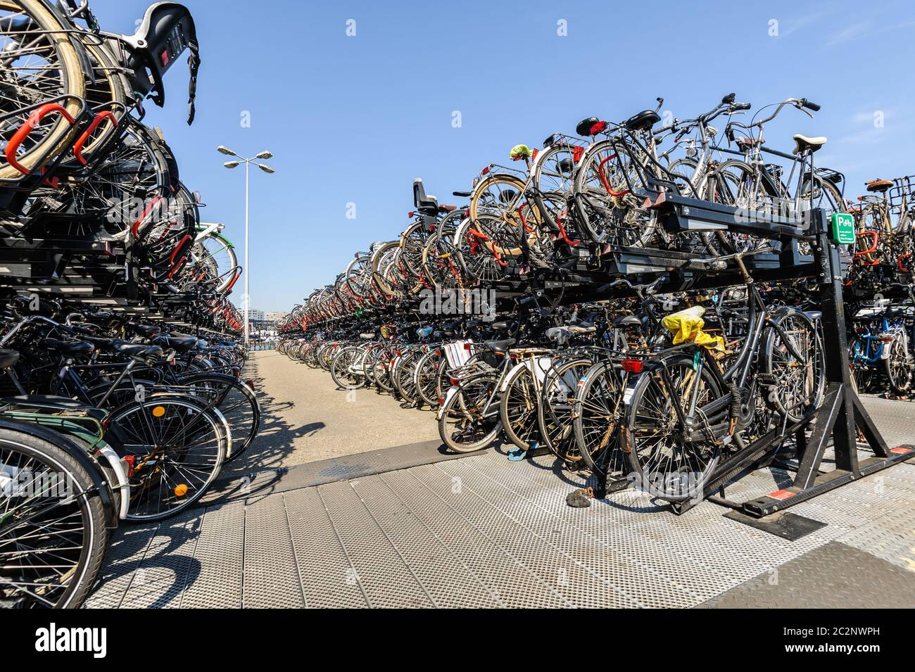 AMSTERDAM, HOLLAND - AUGUST 01: Amsterdam Central station. Many bicycles parked in front of the Central station on August 01, 20 Stock Photo