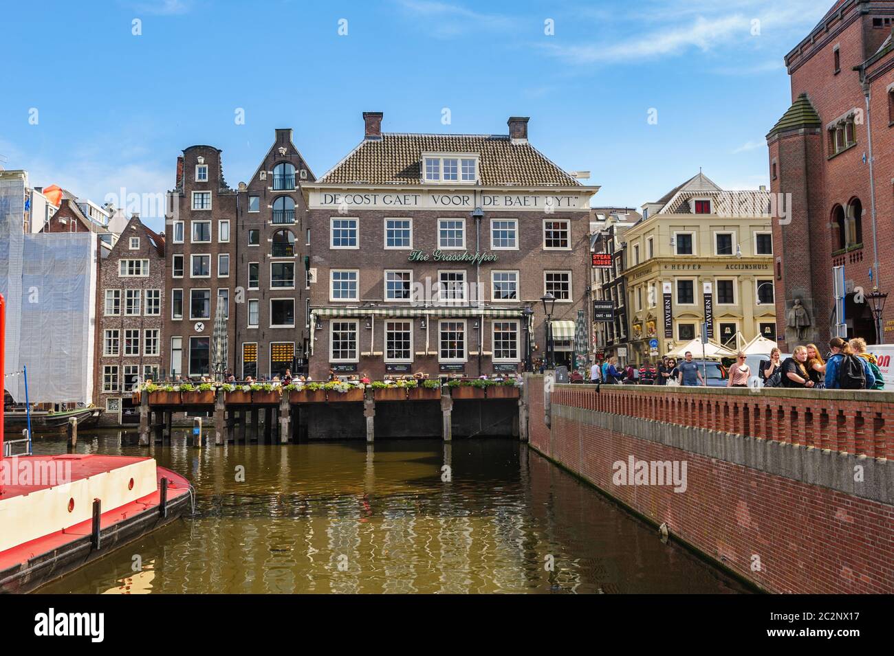 Dancing Canal Houses of Damrak, Amsterdam, Netherlands Stock Photo