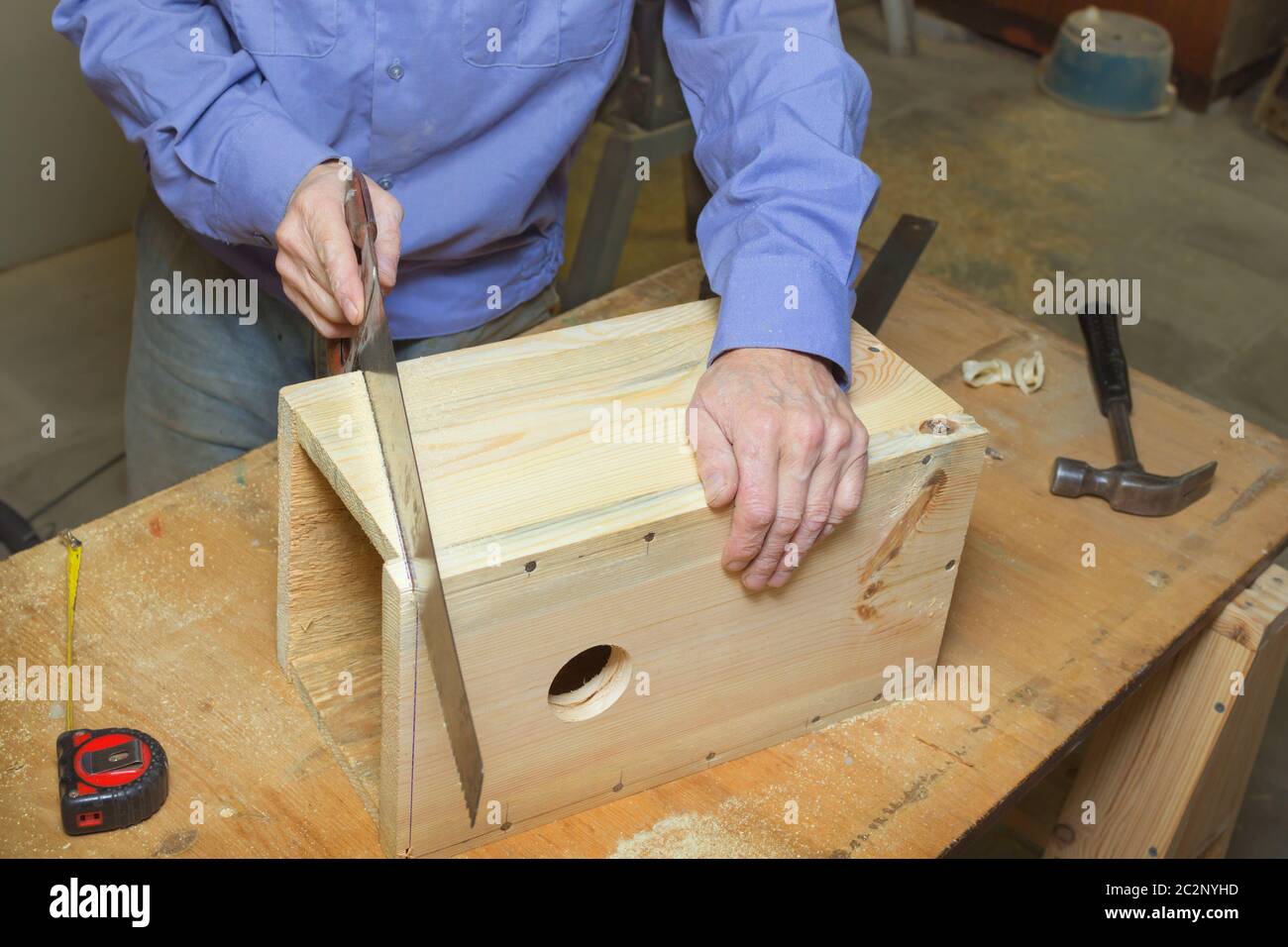 Work on manufacture of birdhouse Stock Photo