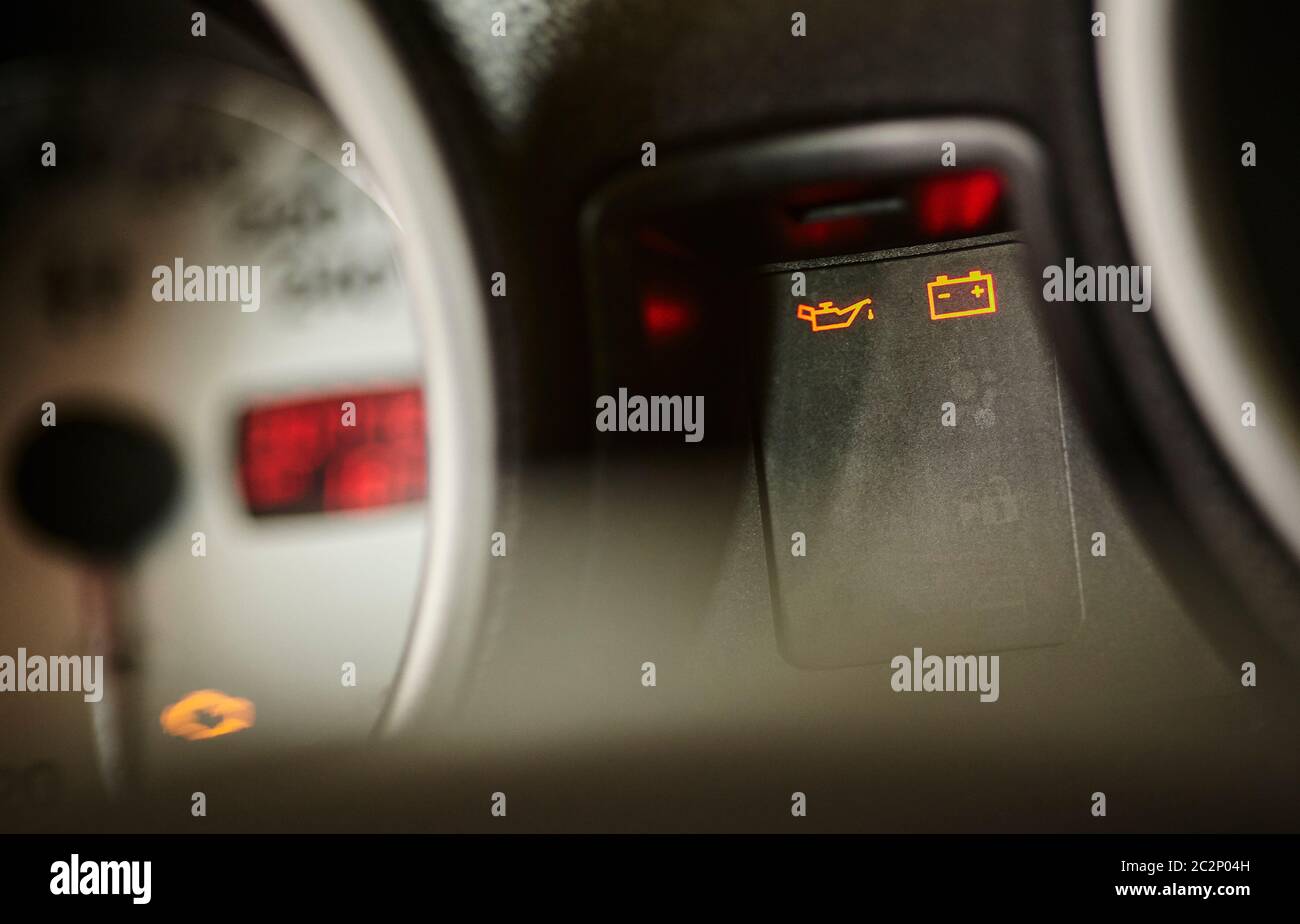 Maintenance and oil change warning lights in the dashboard of a car