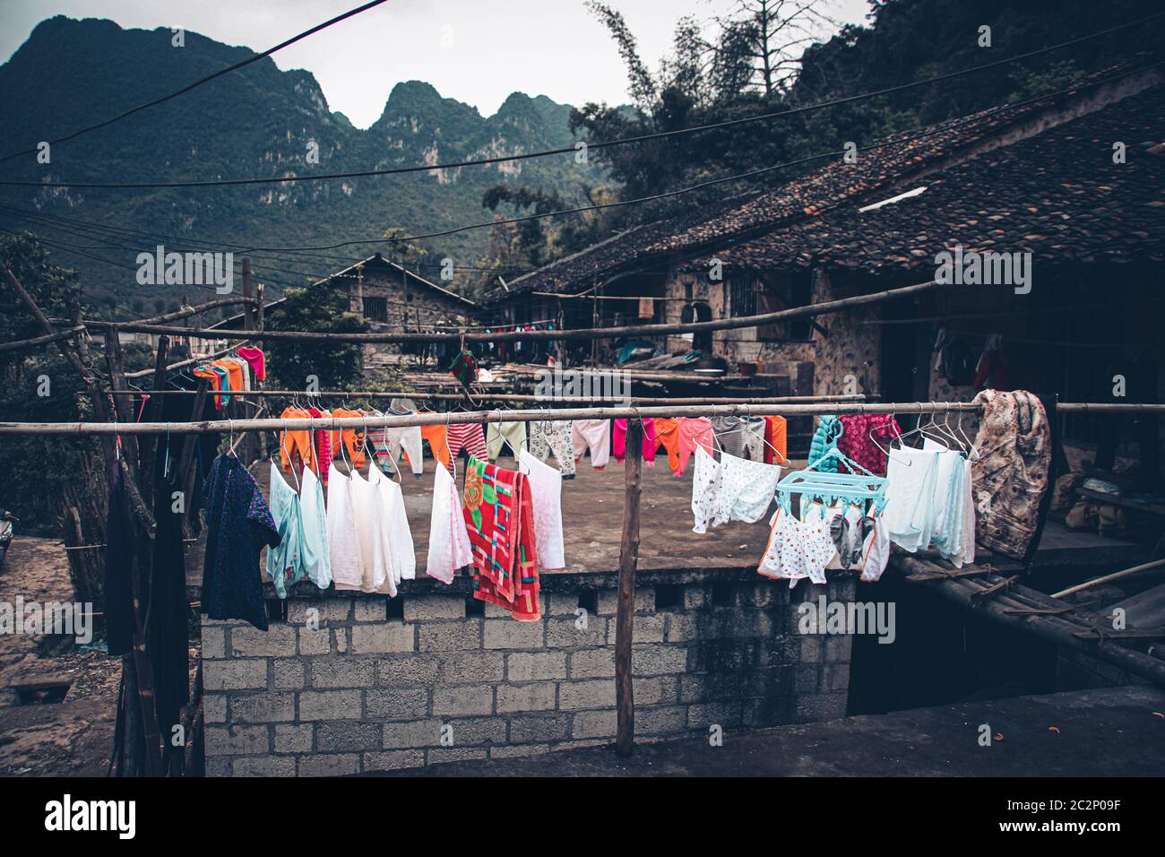 Stilted mud and wood houses of Khuoi Ky rock village built on the karst mountains  in Cao Bang Vietnam shows the old traditions and lifestyle of Vietn Stock Photo