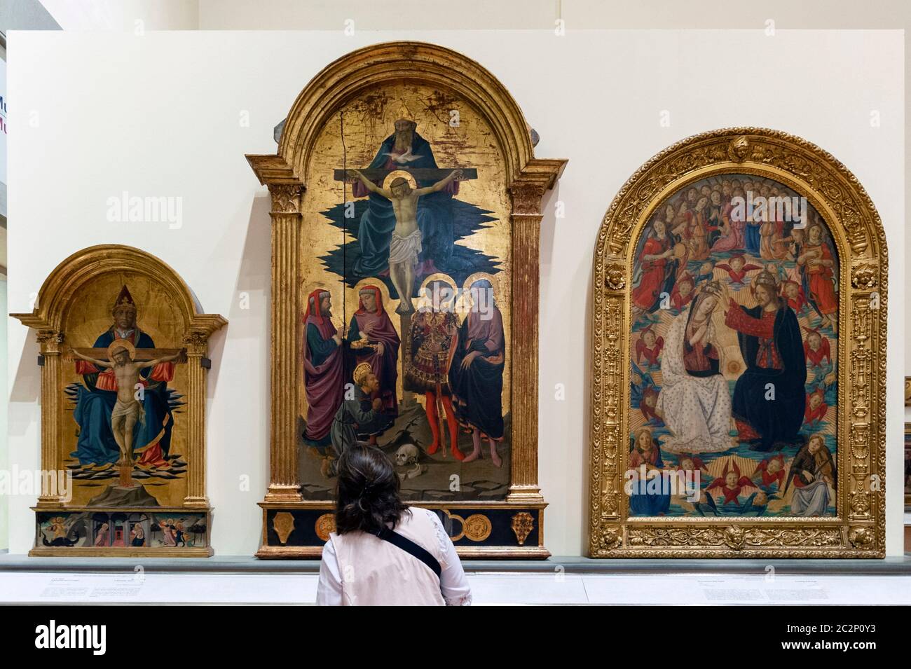 Visitor to the Galleria dell'Accademia di Firenze (Gallery of the Academy  of Florence) looking at paintings on the Holy Trinity subjects by Italian  ar Stock Photo - Alamy