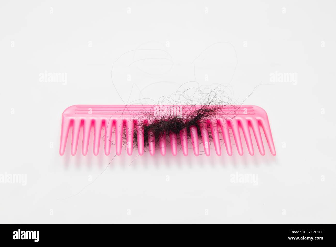 fallen hair stuck into comb Stock Photo Alamy