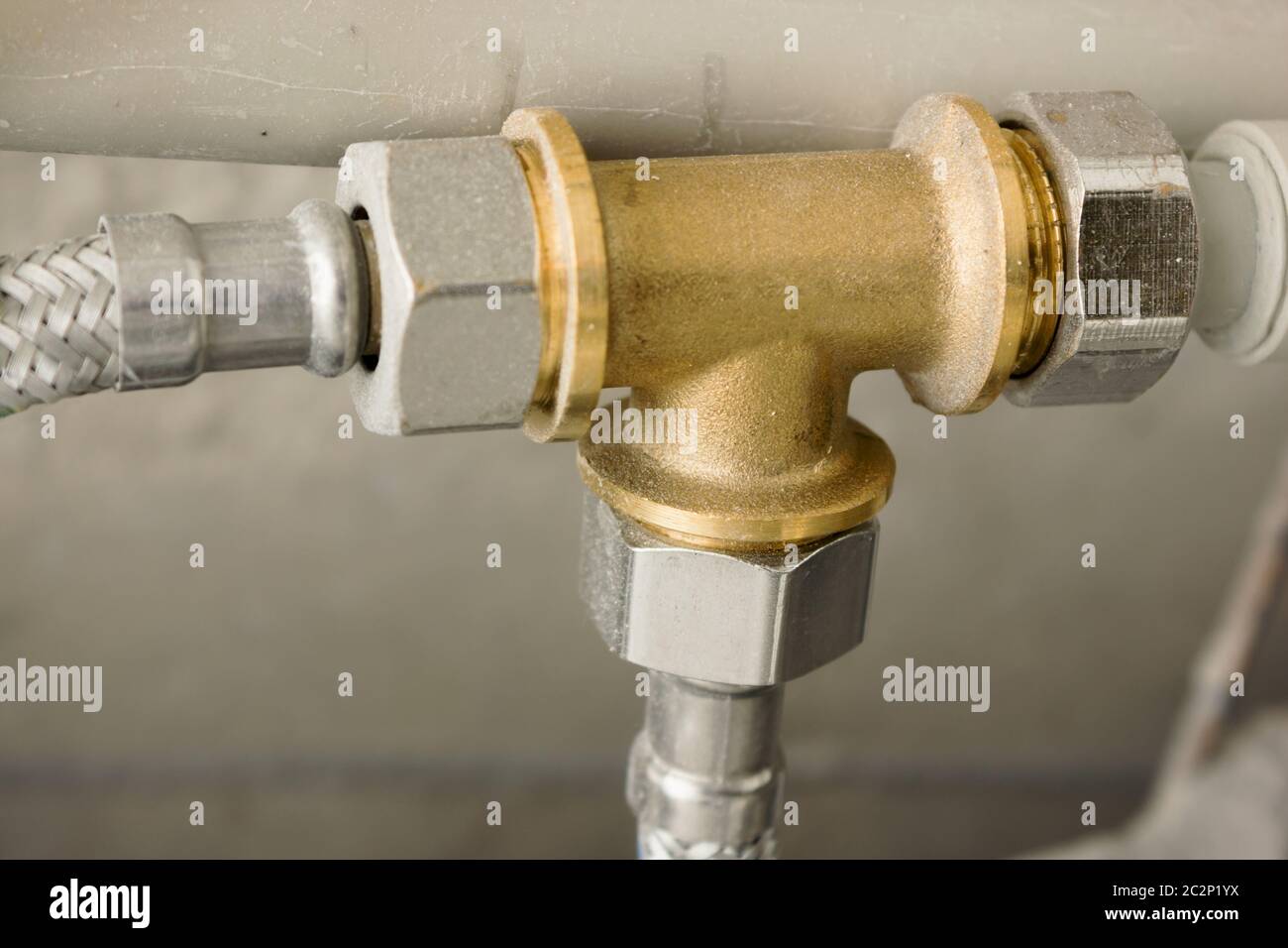 Brass part in water supply system Stock Photo