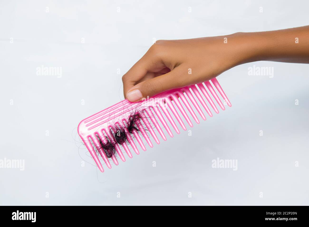 fallen hair stuck into comb Stock Photo Alamy