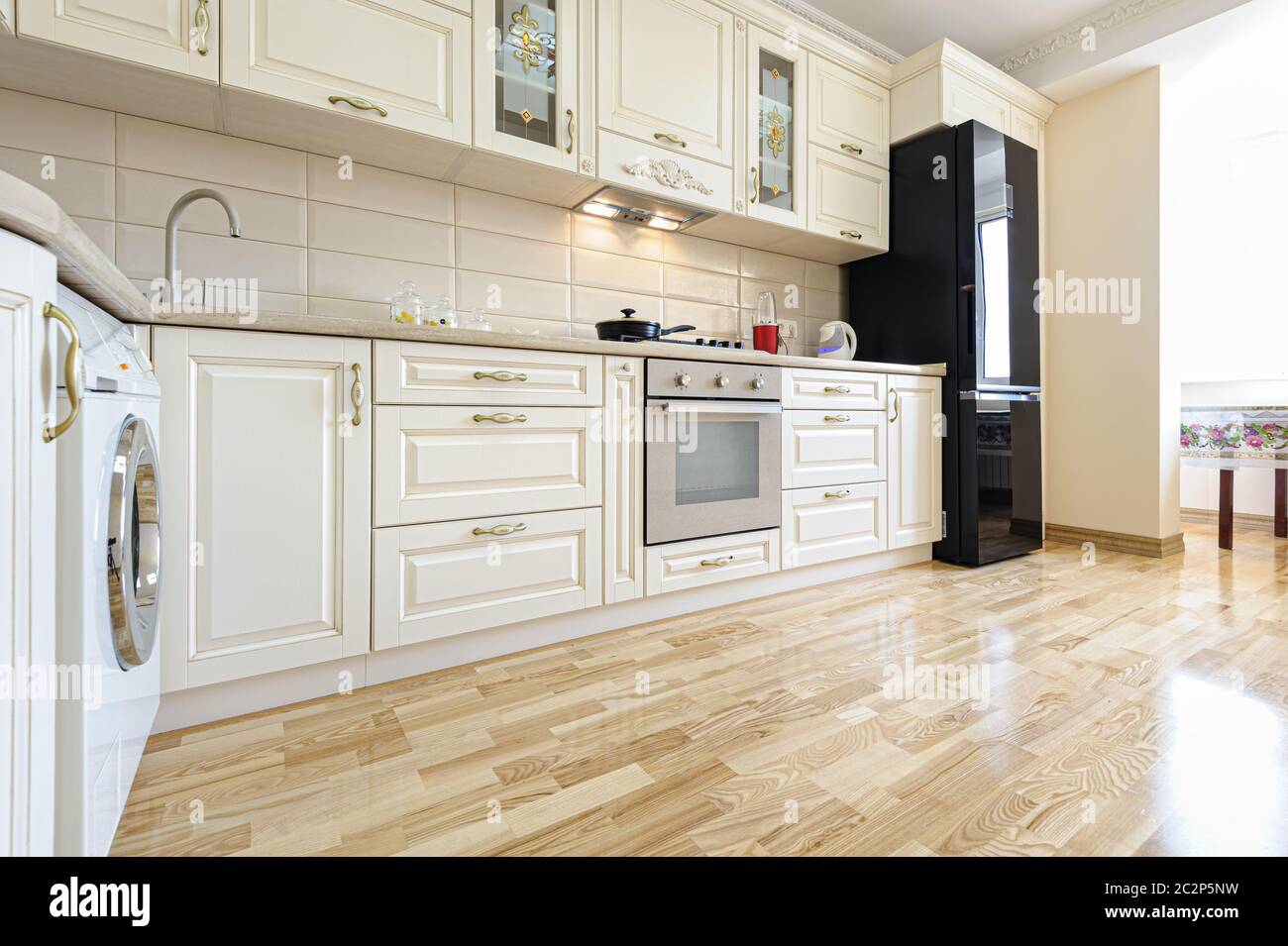 Luxury modern beige and white kitchen interior Stock Photo