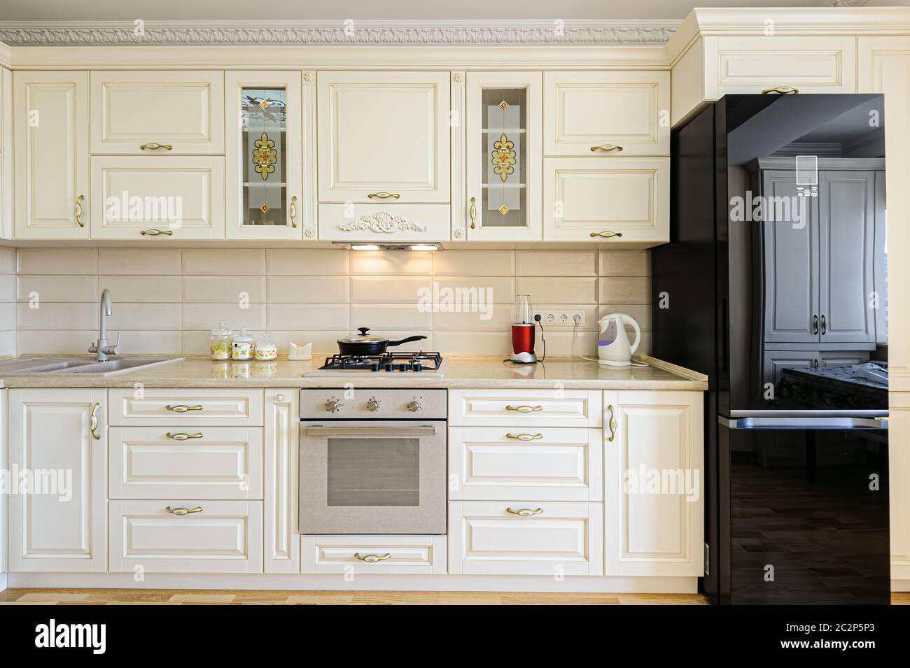 Luxury modern beige and white kitchen interior Stock Photo