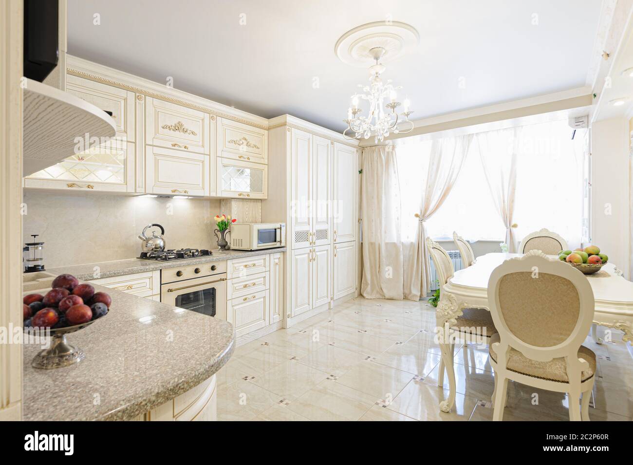 Luxury modern beige and cream colored kitchen interior Stock Photo