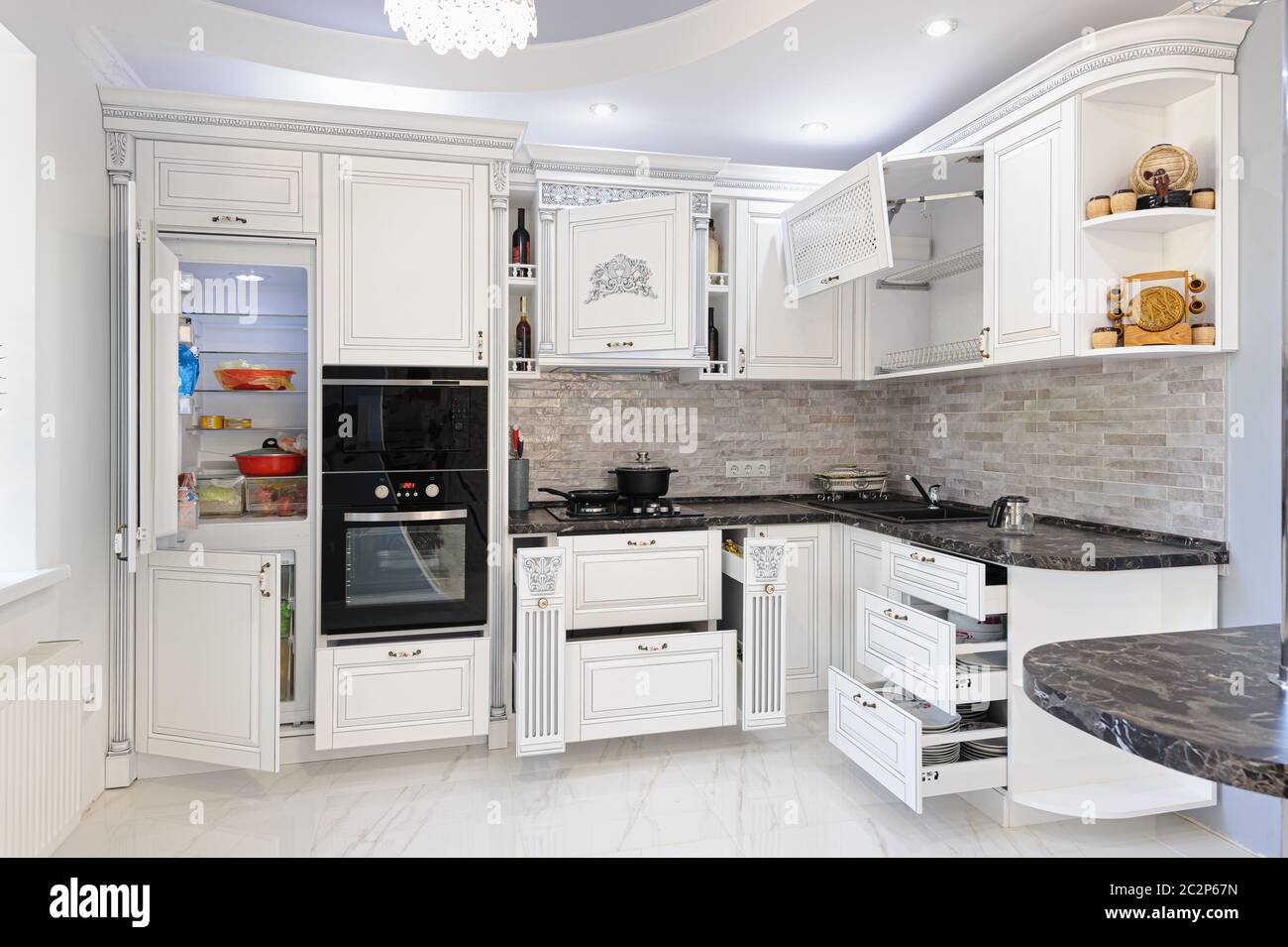 Luxury modern white colored kitchen interior Stock Photo