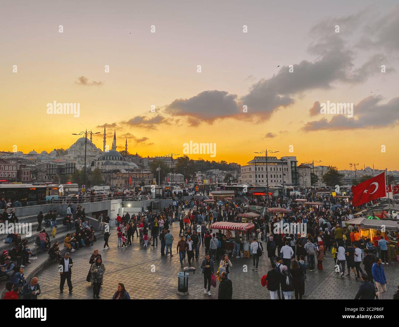 October 27, 2019. Eminonu square by sunset, Istanbul, in Turkey. People rest and socialize in a square near Galata Bridge, shopp Stock Photo