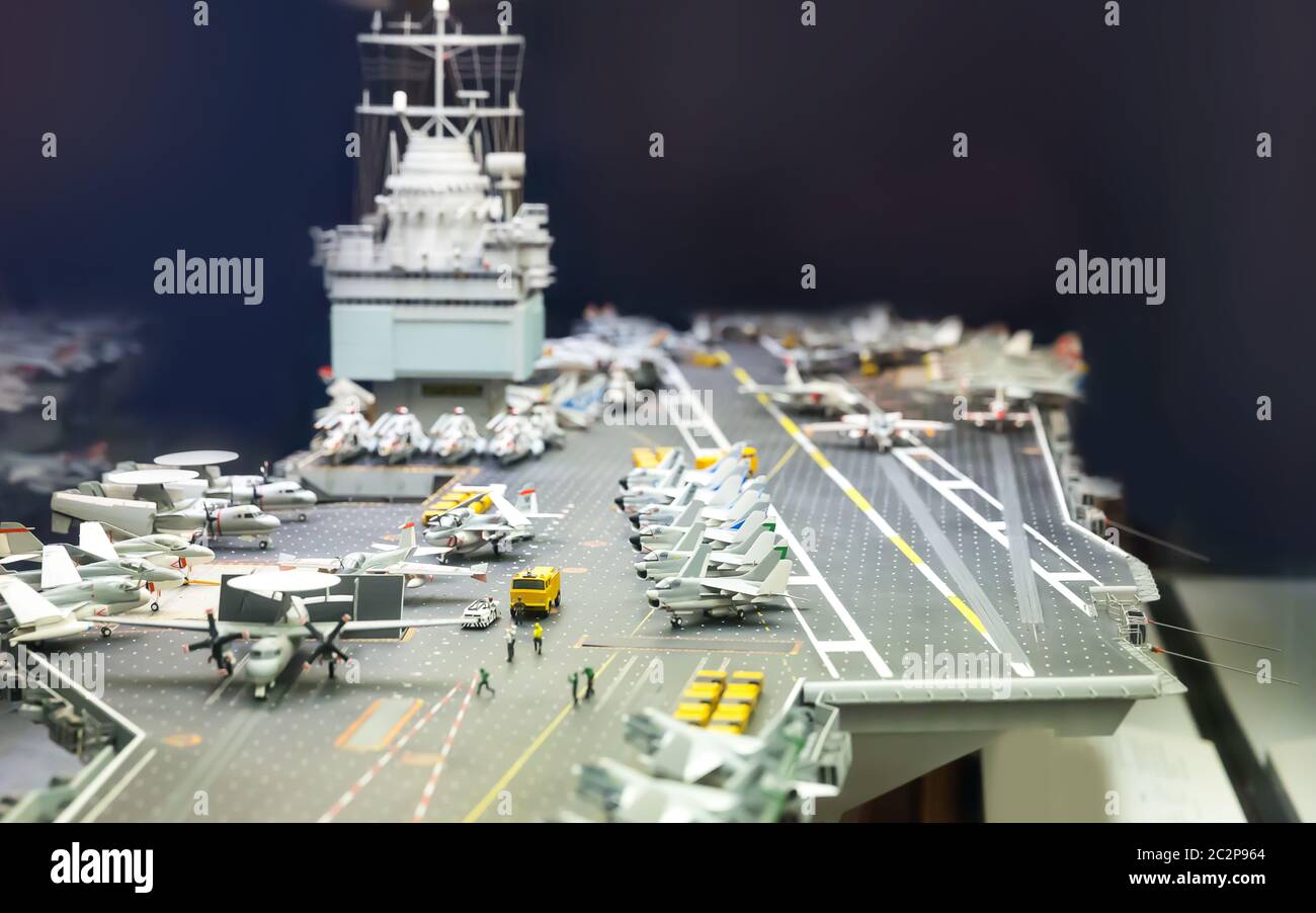 Miniature model of aircraft carrier on black background Stock Photo Alamy