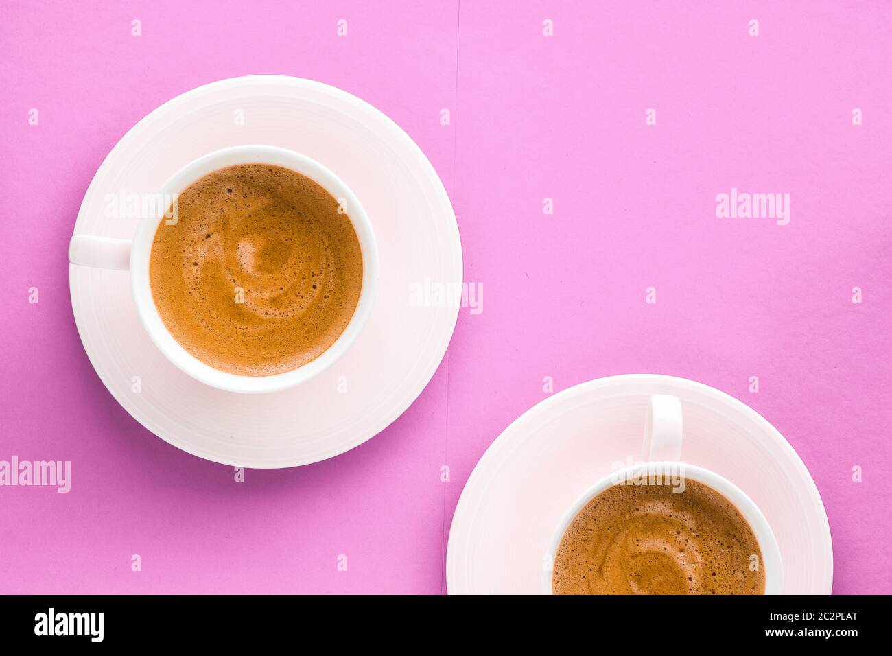 Cup of hot french coffee as breakfast drink, flatlay cups on pink