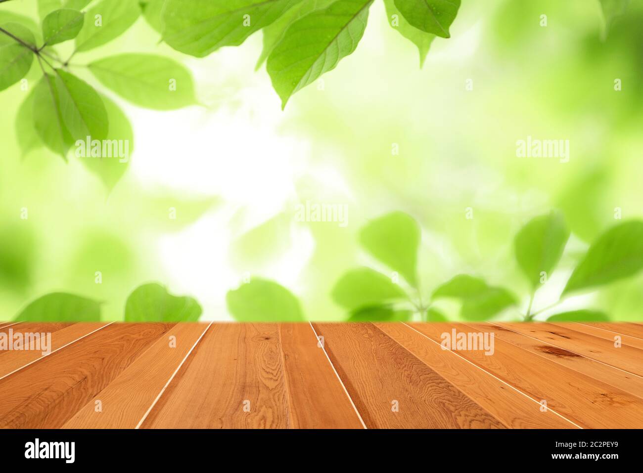 Wood table top on blur abstract green leaf from garden in the morning  background Stock Photo - Alamy