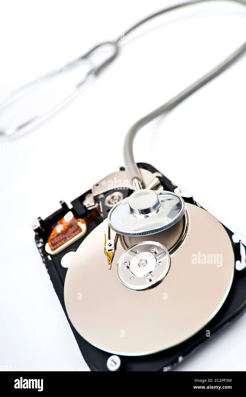 Opened hard drive with stethoscope on top, checking your data, verifying your information, scan for viruses your computer Stock Photo