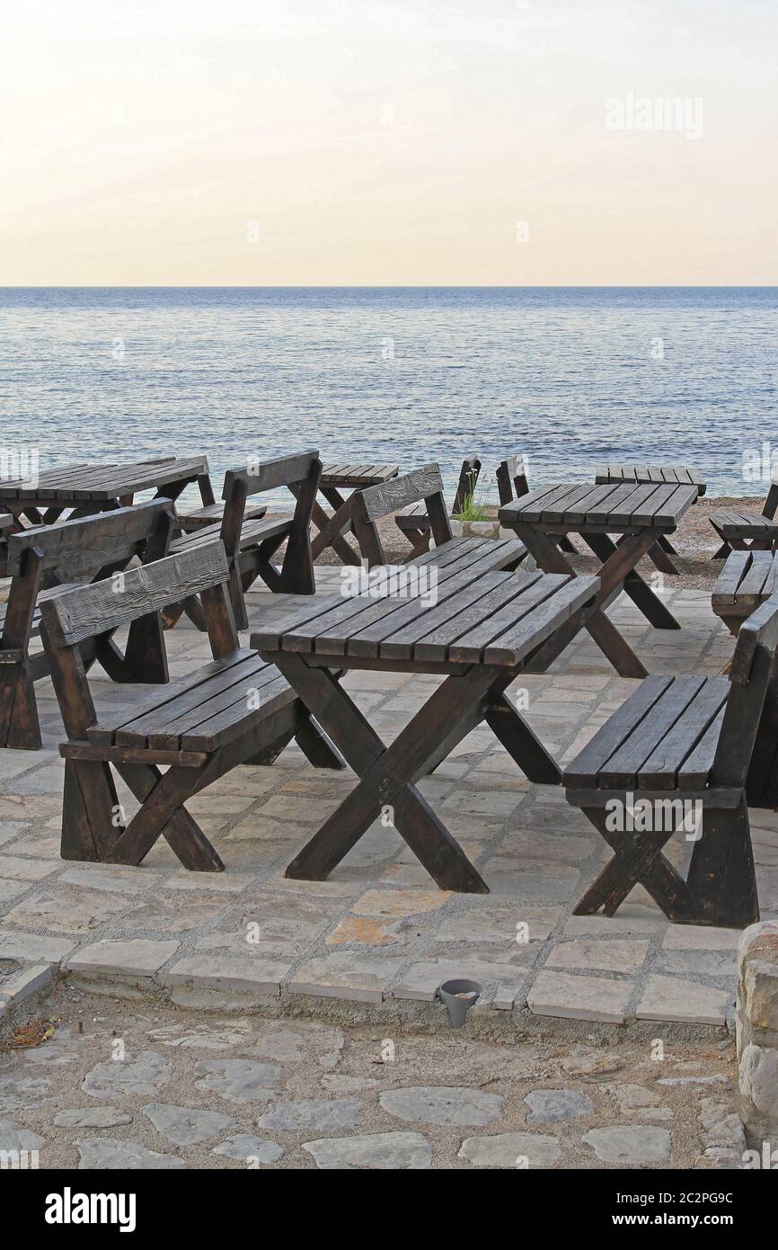 Wooden Picnic Tables With Benches at Seaside Coast Stock Photo Alamy