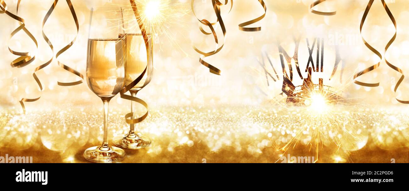 Golden sparkling new years eve background with champagne and streamers ...