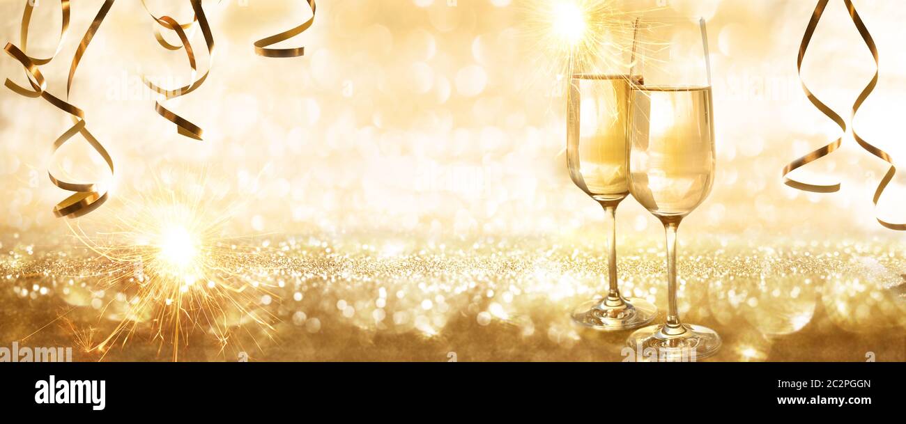 Golden sparkling new years eve background with champagne and streamers ...