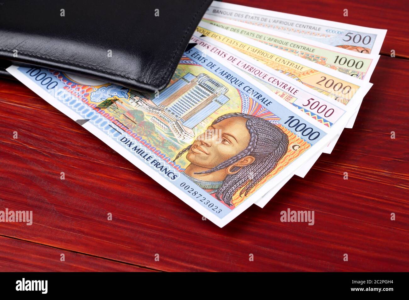 Old Central African money in the black wallet Stock Photo