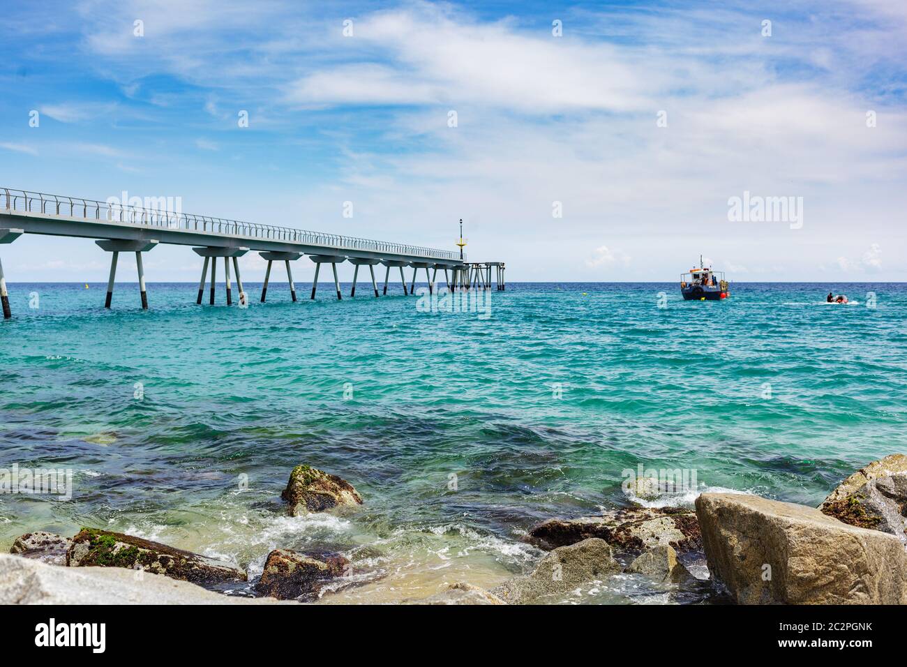Oil Bridge located in Badalona,Spain. A bridge over the sea of about ...