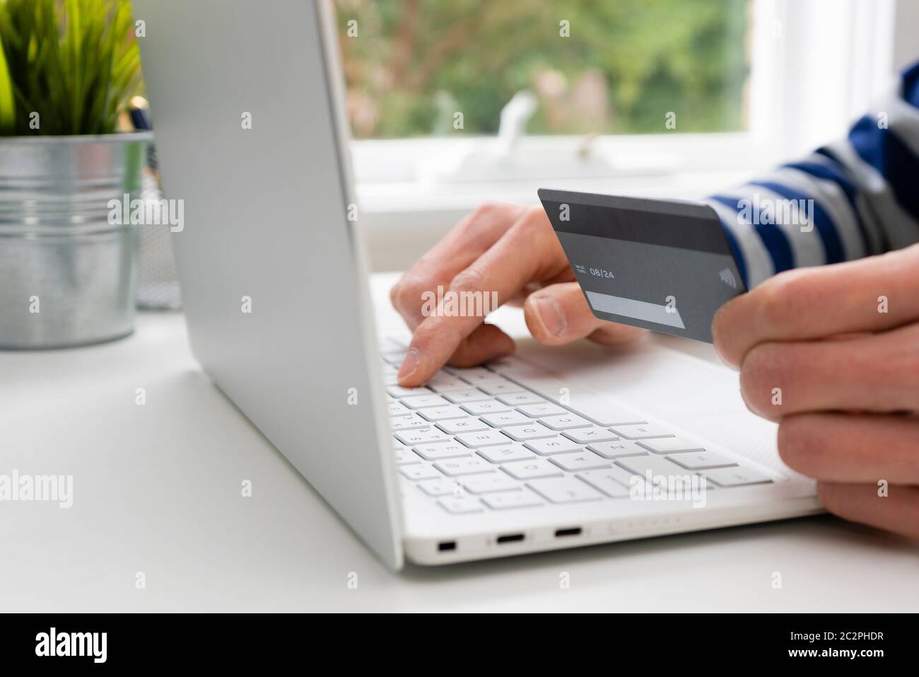 Using credit card for online shopping Stock Photo