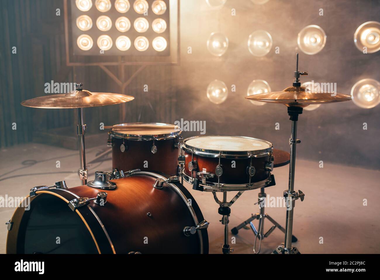 Drum kit, percussion instrument on the stage with lights, nobody
